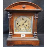 An early 20th century mahogany arch top architectural mantel clock, eight day movement,