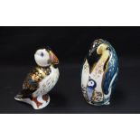 A Royal Crown Derby paperweight, Penguin and Chick, gold stopper, boxed; another, Puffin,