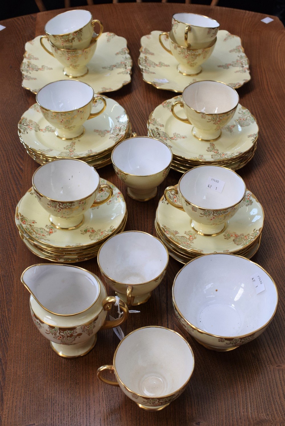 A Royal Standard part tea service, gilt on a yellow ground, including cups, saucers, side plates,