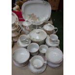 A Denby Pottery Portugal pattern dinner and tea service including teapot, cups, saucers,