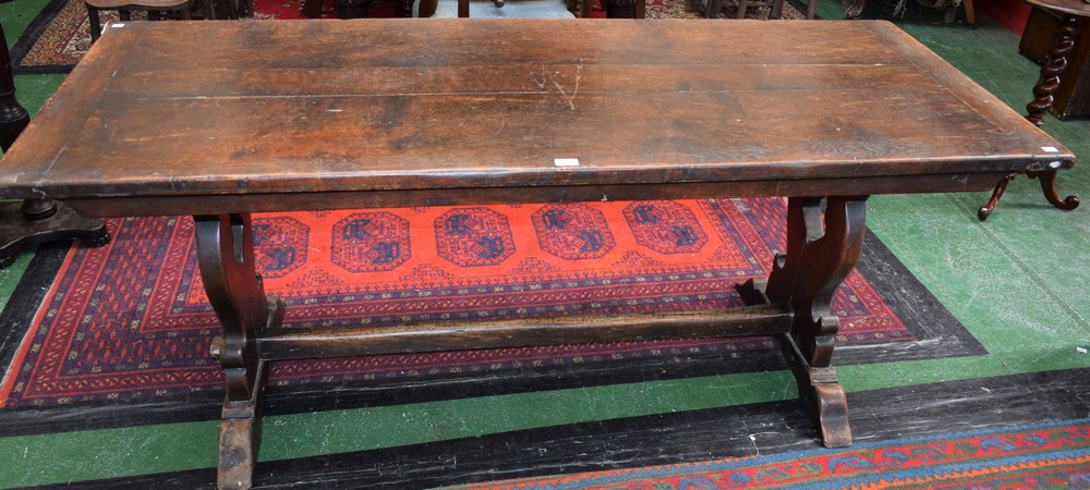 An 18th century oak refectory style, trestle type dining table, rectangular top,