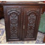 A 19th century German oak side cabinet,