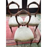 A set of three late Victorian style mahogany side chairs,