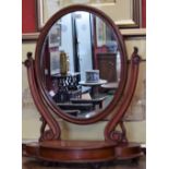 A Victorian mahogany oval dressing table mirror, with hinged compartment, 69cm x 59cm, c.