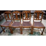 A set of four oak dining chairs