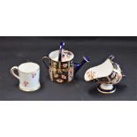 A Royal Crown Derby 2451 pattern miniature watering can; a similar miniature coal scuttle;