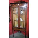 An Edwardian mahogany floor standing corner display cabinet,