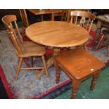 A 20th century circular dropleaf dining table,