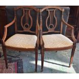 A pair of mahogany side chairs, curved cresting rail, lyre-shaped splat, reeded arms,