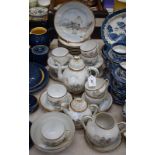 A Japanese eggshell porcelain Export Ware tea set, comprising cups, saucers, plates, teapot,