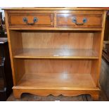 A reproduction yew hall table, crossbanded top above a pair of short drawers and a shelf,