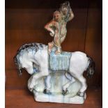 An unusual Art Pottery flatback model, of a water carrier standing on horseback,