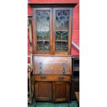 An Arts and Crafts style oak bureau bookcase,