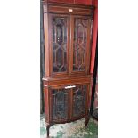 A George III Revival floor standing corner display cabinet,