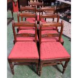 A set of seven 19th century mahogany dining chairs comprising six side chairs and a carver,