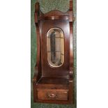 An early 20th century mahogany hall mirror,