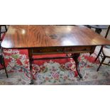 A Regency mahogany sofa table, rectangular top with fall leaves above a pair of frieze drawers,