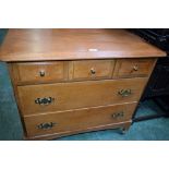 A mid-20th century mahogany chest, rounded rectangular top above three short and two long drawers,