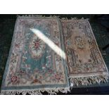 A Chinese woven wool carpet, stylised flowers of cream, pink, green and mink on a pale green ground,