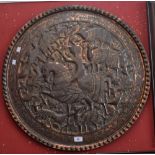 A Persian style copper charger embossed in low relief with an image of The Shah hunting,