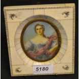 A late 19th century portrait miniature of an elegant young lady