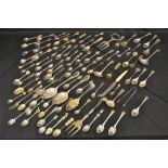 A quantity of plated and white metal souvenir and other spoons, berry spoons, bread forks,