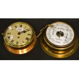 A wall mounted brass clock, Roman numerals, subsidiary dial; a circular aneroid barometer,