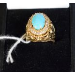 An Iranian yellow metal ring, diamond and turquoise set cluster ring,