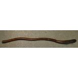 A Chinese carved walking stick, the terminal carved with an elder,