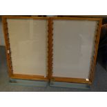 A pair of pine glazed single door wall hanging display cabinets