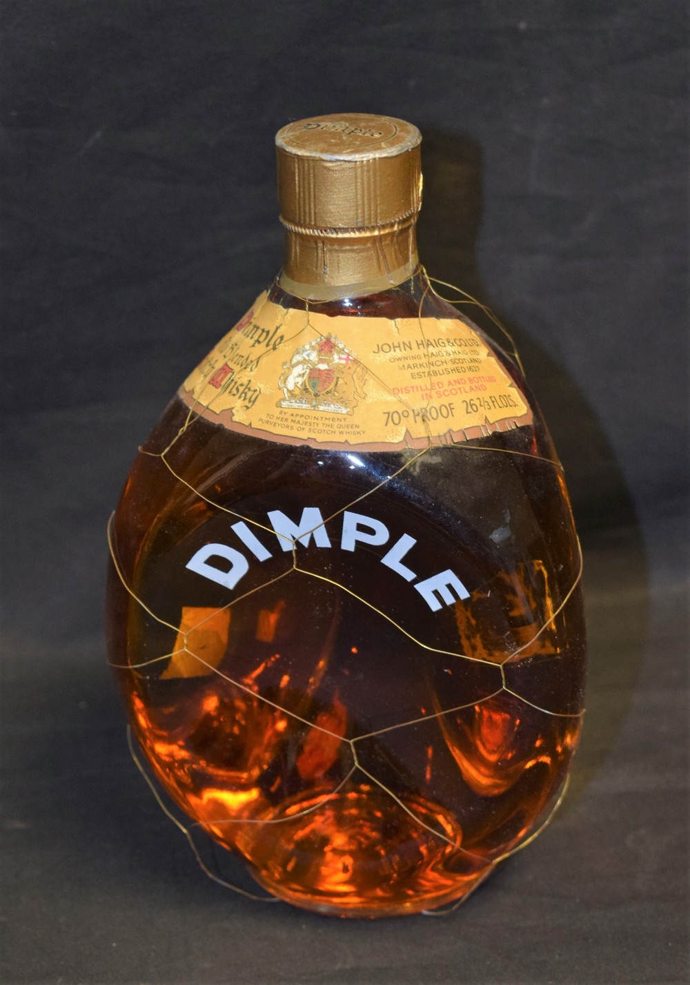 A mid 20th century bottle Dimple whisky,