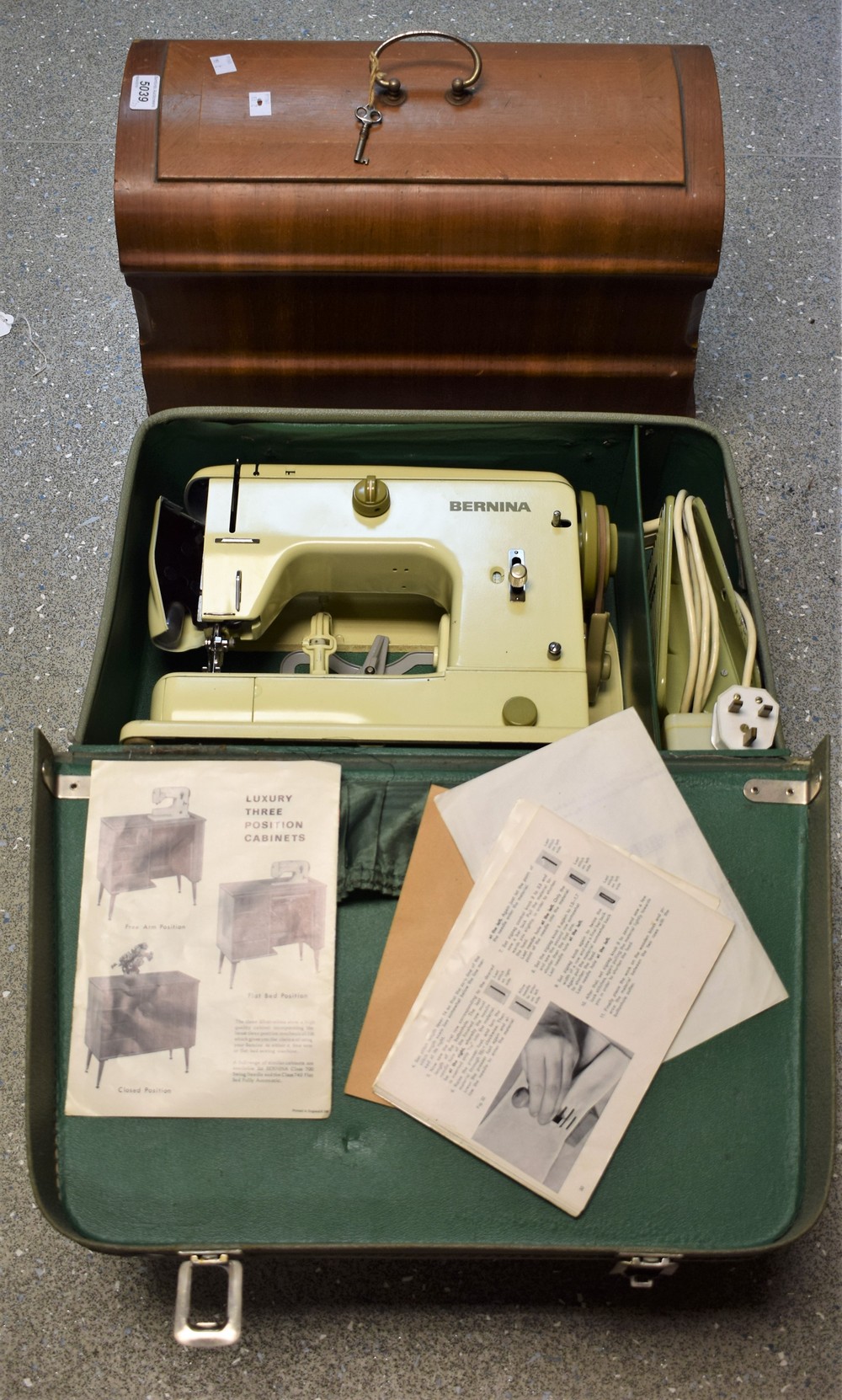 An early 20th century Vesta hand operated sewing machine, wooden cased; another,