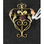 An Edwardian amethyst effect paste and seed pearl open heart scrolling pendant brooch,
