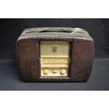 A 1950's Ultra Twin-De-Luxe portable radio with crocodile skin effect case,
