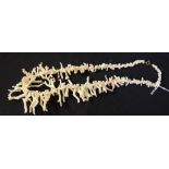 A creamy white and pink coral single strand necklace, graduated natural frond beaded body,