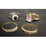 Rings - a dark blue sapphire and diamond oval cluster ring; others pinky purple quartz,