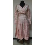 A mid 20th century baby pink brocade wedding dress,1959, mid length, crossover bodice,