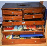 Engineering - a craftsman's mahogany cabinet containing protractors, compasses, calipers,