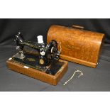 An early 20th century Singer hand-crank sewing machine, Y8094606,