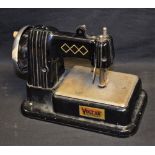 A 1950's Vulcan 'Dumpy' toy sewing machine