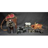 A pair of French sporting binoculars, leather case; a pair of opera glasses; others,