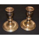 A pair short weighted silver candlesticks, baluster form, A T Cannon Ltd,