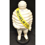 Advertising - a large reproduction cast iron model, Michelin Tyre Man, standing on a tyre,