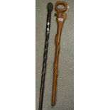 An African carved hardwood walking stick;