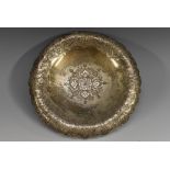 A Persian silver shaped circular pedestal dish,