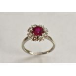 A ruby and diamond floral cluster ring, central vibrant red ruby approx 1.