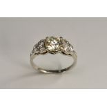 A seven stone diamond ring, central round modern brilliant cut diamond approx 1.