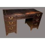 A Chinese hardwood twin pedestal desk, rectangular panel top above three frieze drawers,