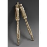 A pair of Chinese silver nut crackers, chased with scrolling leafy stems, 19.