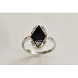 A diamond and black onyx Art Deco panel ring, central black onyx diamond shaped matrix,